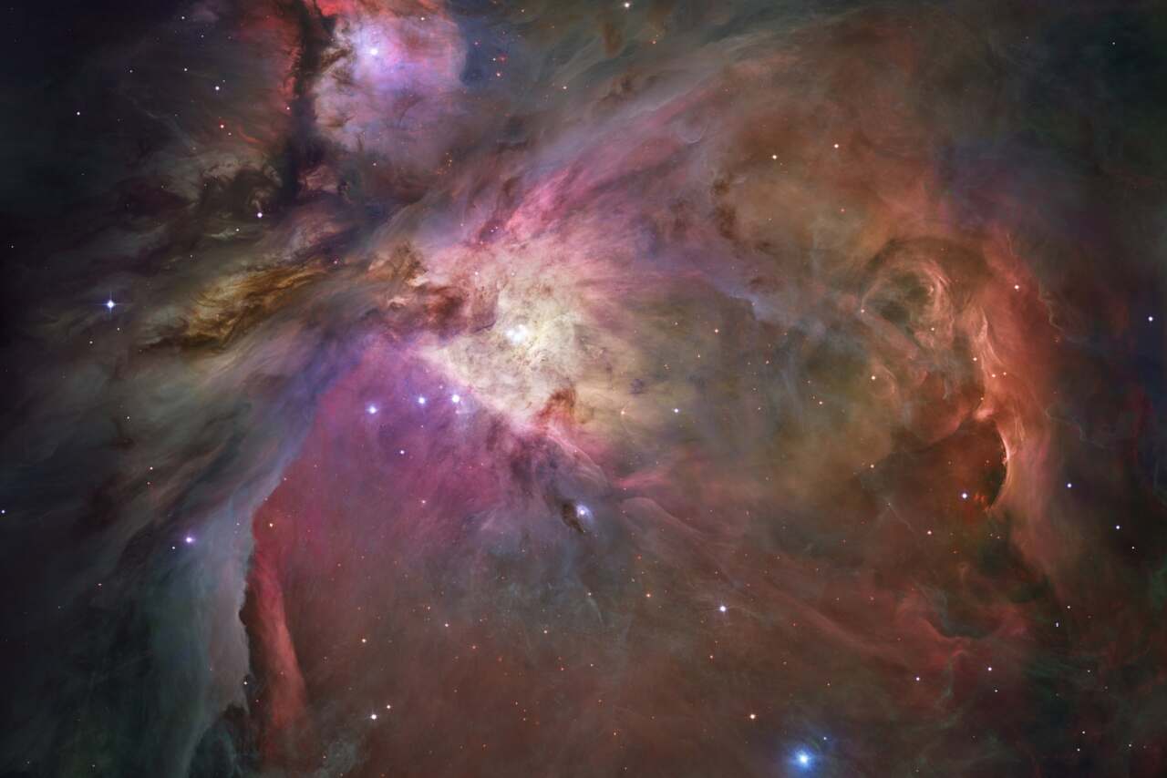 Detailed image of the Orion Nebula, showcasing its vibrant colors and intricate cloud-like structures in deep space.